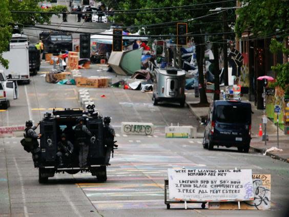 Seattle police brings in teams to clear the area ‘ceded’ to demonstrators (Reuters)