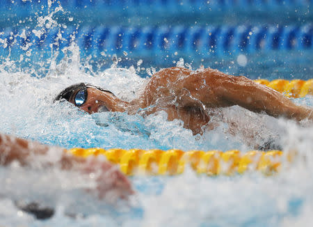 FILE PHOTO: Swimming - 2018 Asian Games - Men's 100m Freestyle Heats - GBK Aquatic Center- Jakarta, Indonesia - August 23, 2018 - Kenneth To King Him of Hong Kong competes. REUTERS/Athit Perawongmetha