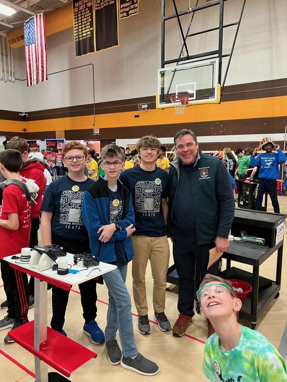 Members of the Pellston FTC TEam, Artificial Intelligence, pose with Michigan Sen. John Damoose.