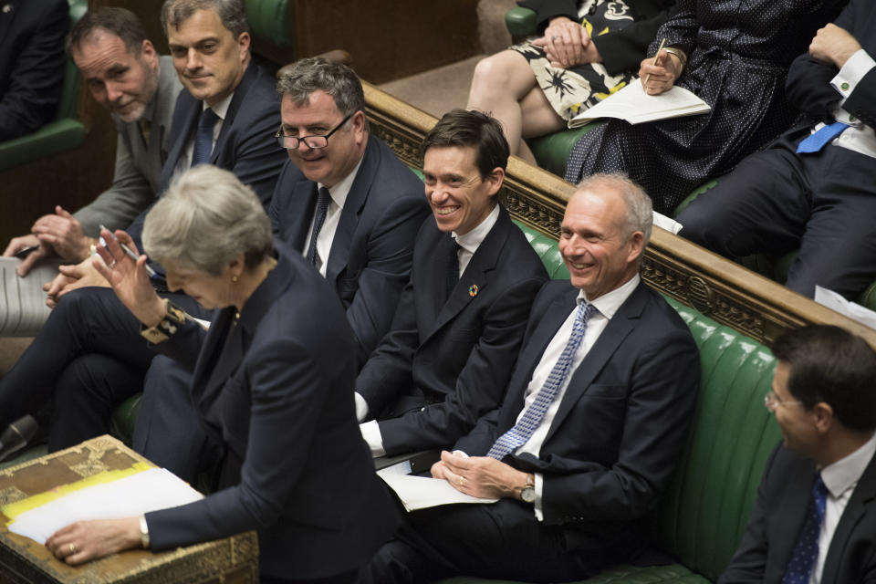 Rory Stewart, centre, rose to international development secretary in Theresa May's government. (PA)