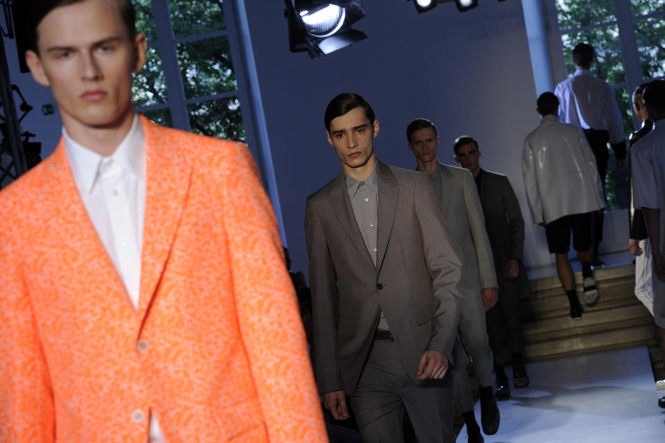 Models wear creations of the Jil Sander men's Spring-Summer 2014 collection, part of the Milan Fashion Week, unveiled in Milan, Italy, Saturday, June 22, 2013. (AP Photo/Giuseppe Aresu)