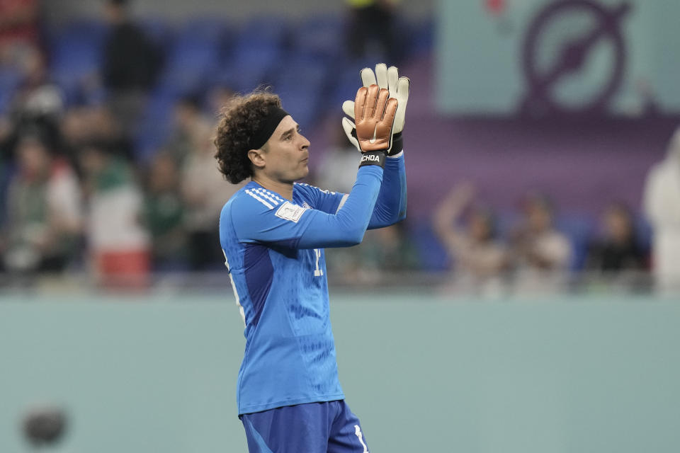 Mexico's goalkeeper Guillermo Ochoa leaves the field after the World Cup group C soccer match between Mexico and Poland, at the Stadium 974 in Doha, Qatar, Tuesday, Nov. 22, 2022. (AP Photo/Moises Castillo)