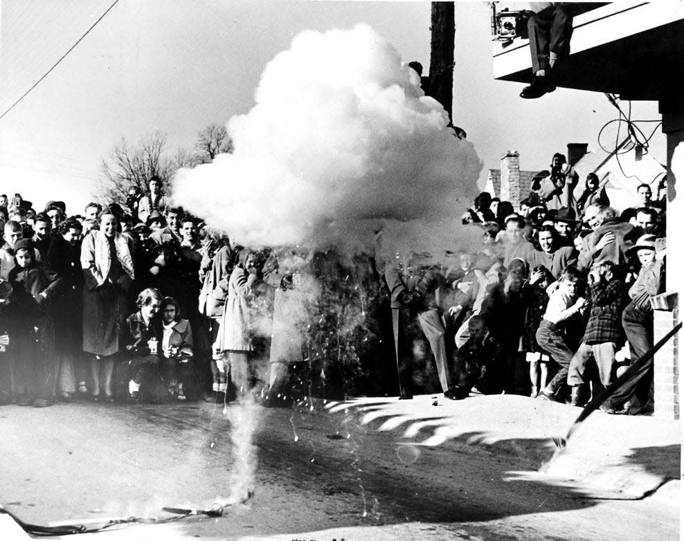 The famous gate opening 'explosive' ribbon-cutting ignited by an electrical signal generated from the Graphite Reactor at the Oak Ridge National Laboratory.