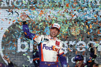 Denny Hamlin celebrates in Victory Lane after winning the NASCAR Cup Series auto race Sunday, Nov. 10, 2019, in Avondale, Ariz. (AP Photo/Ralph Freso)