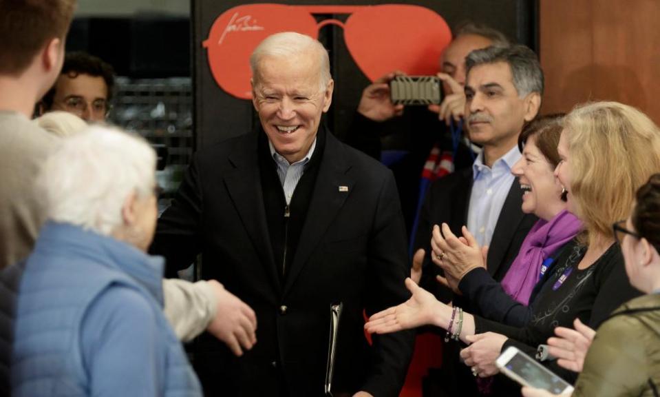 Joe Biden shakes hands as he arrives to talk to voters in Hampton, New Hampshire, on 9 February.
