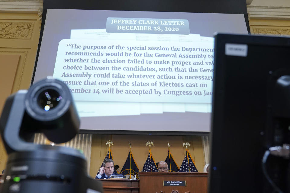 A portion of a draft letter from Jeffrey Clark is displayed as the House select committee investigating the Jan. 6 attack on the U.S. Capitol continues to reveal its findings of a year-long investigation, at the Capitol in Washington, Thursday, June 23, 2022. (AP Photo/Jacquelyn Martin)