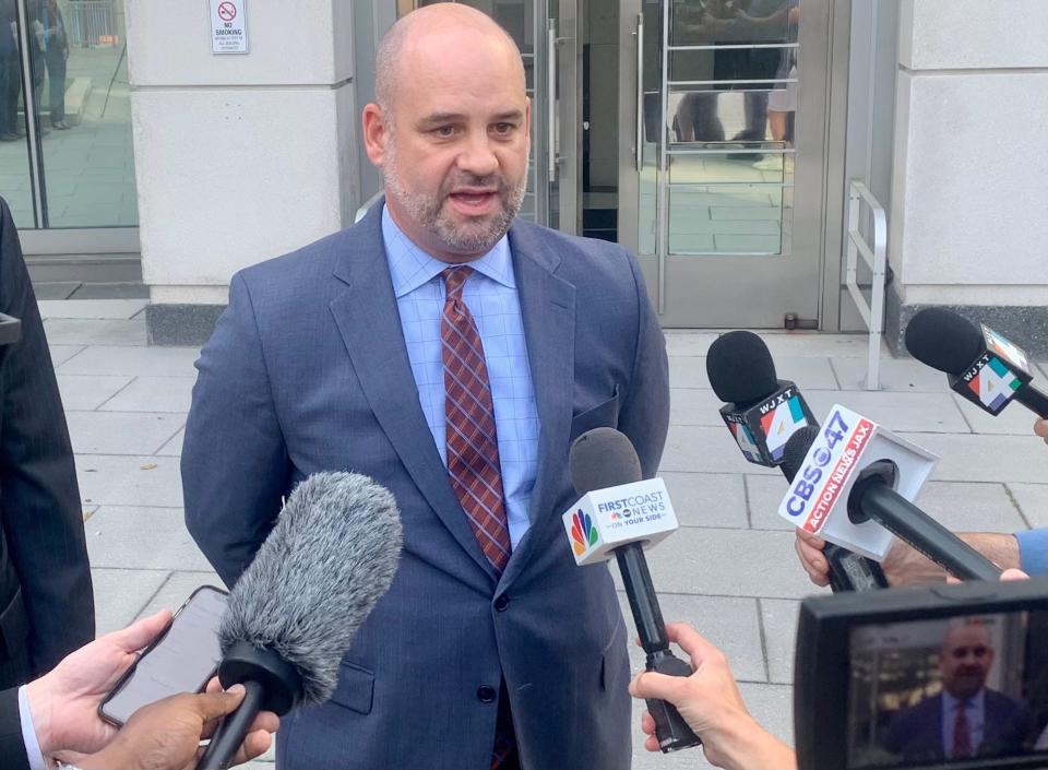 Assistant U.S. Attorney A. Tysen Duva talks to reporters Friday after a federal jury convicted former JEA CEO Aaron Zahn on charges of conspiracy and wire fraud. Duva gave his remarks outside the federal courthouse in downtown Jacksonville.