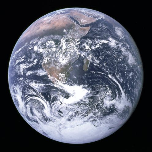 <span class="caption">This image of the Earth from a distance, known as the Blue Marble, was taken by Apollo 17 astronauts.</span> <span class="attribution"><a class="link " href="https://www.flickr.com/photos/nasamarshall/8250851747" rel="nofollow noopener" target="_blank" data-ylk="slk:NASAMarshall/Flickr;elm:context_link;itc:0;sec:content-canvas">NASAMarshall/Flickr</a>, <a class="link " href="http://creativecommons.org/licenses/by-sa/4.0/" rel="nofollow noopener" target="_blank" data-ylk="slk:CC BY-SA;elm:context_link;itc:0;sec:content-canvas">CC BY-SA</a></span>