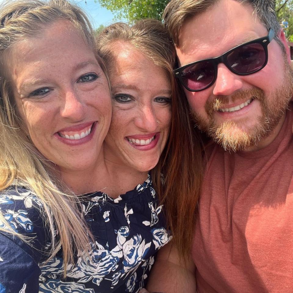 Conjoined twins Abby and Brittany Hensel with Abby’s husband, Josh Bowling. Joshua Bowling / Facebook