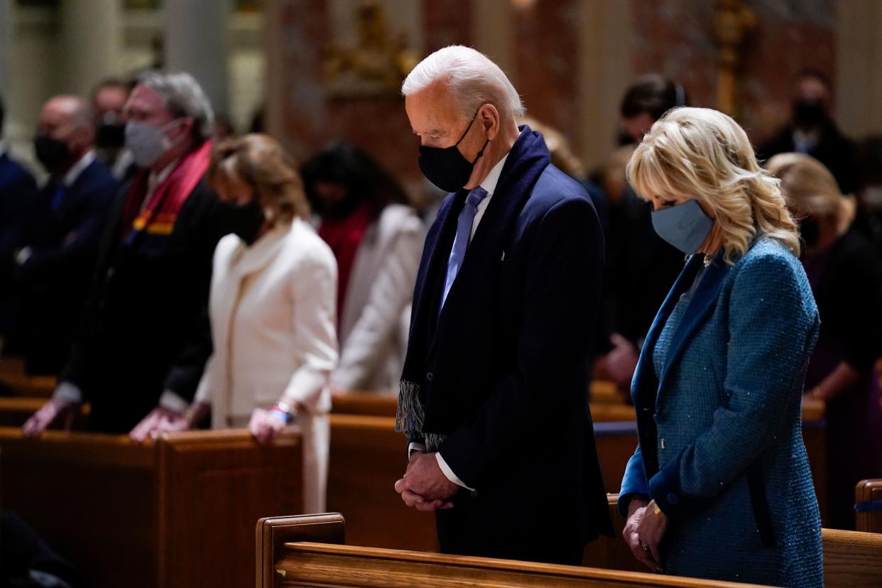 President-elect Joe Biden and his wife, Jill Biden, attend Mass at the Cathedral of St. Matthew the Apostle in Washington before his inauguration Wednesday. (Photo: Evan Vucci/ASSOCIATED PRESS)