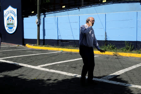 Journalist Carlos Fernando Chamorro, critic of the government of President Daniel Ortega speaks on his cell phone in front of the main entrance of police headquarters in Managua, Nicaragua December 15, 2018.REUTERS/Oswaldo Rivas