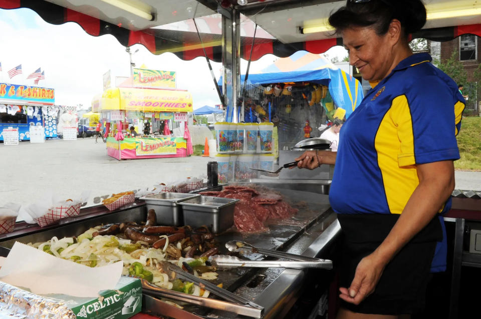 Marlena Desjarlais cooks roast beef and other foods at the Brockton Fair on Saturday, July1, 2017.