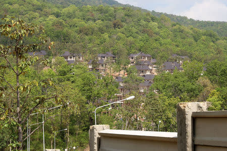 The construction site of a government luxury housing project earmarked as homes for judges on land in the foothills of Doi Suthep mountains is seen in Chiang Mai, Thailand May 6, 2018. REUTERS/Panu Wongcha-um