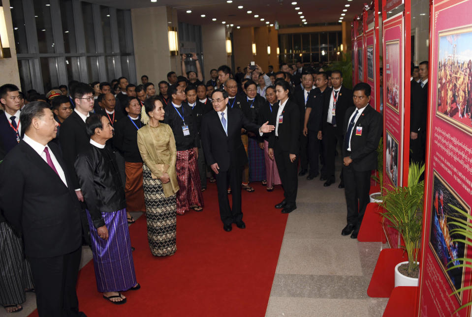 In this Jan. 17, 2020, photo provided by Myanmar News Agency (MNA), Chinese President Xi Jinping, left, Myanmar President Win Myint, second from left, and Myanmar leader Aung San Suu Kyi, third from left, attend a ceremony to mark the Myanmar-China 70th Anniversary of Establishment of Diplomatic Relations in Naypyitaw, Myanmar.(Myanmar News Agency via AP)