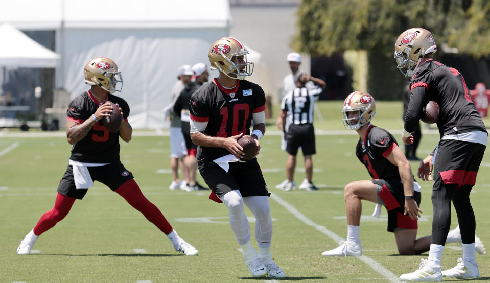 San Francisco 49ers quarterback Trey Lance and quarterback Jimmy Garoppolo looks to pass during NFL football practice in Santa Clara, Calif., Wednesday, June 2, 2021. (AP Photo/Josie Lepe)