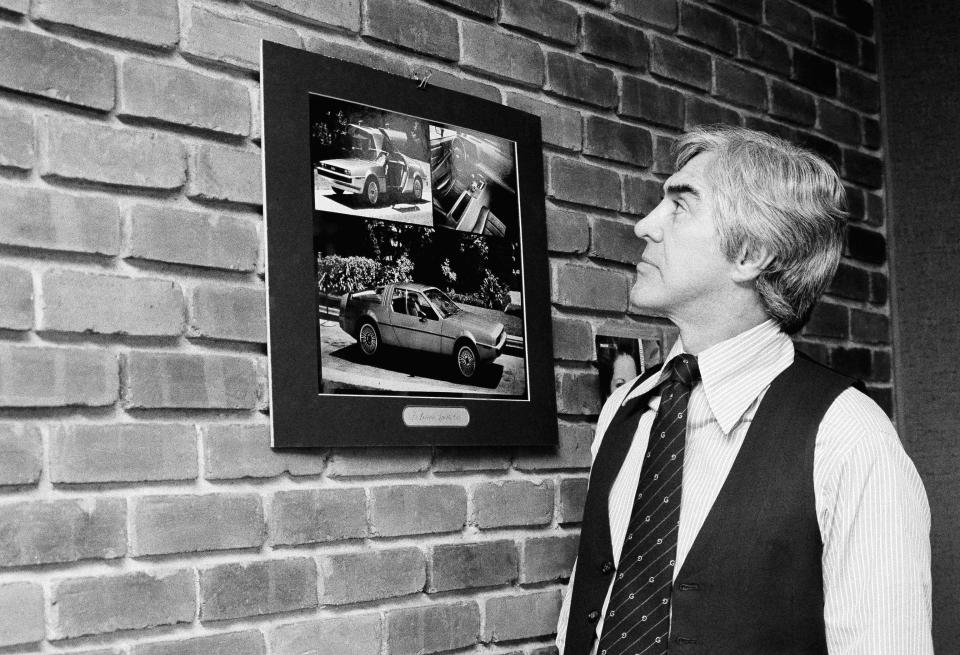 Quit General Motors to start his own firm John Z. DeLorean who stunned the auto industry five years ago by quitting a top post at general motors, looks over photos of the sports car the DeLorean motor co. plans to produce in northern Ireland. Starting your own car company is not an original idea, but few have succeeded. DeLorean thinks his effort will be a success, Dec. 6, 1978. (AP Photo/Pickoff)