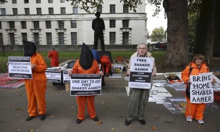 Supporters of Shaker Aamer, the last British prisoner at Guantanamo Bay, demonstrate outside Downing street in central London, October 24, 2015. REUTERS/Paul Hackett