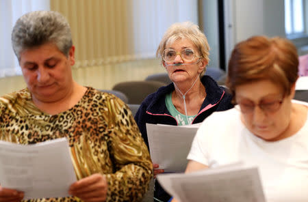 Members of the "Breathing for the Soul" choir, who are patients suffering from lung diseases attend a rehearsal in Budapest, Hungary, November 11, 2018. Picture taken November 11, 2018. REUTERS/Bernadett Szabo