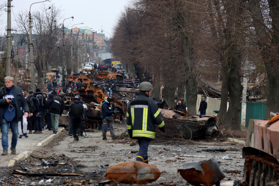 BUCHA, UKRAINE - APRIL 5, 2022 - Journalists view the ruins in Vokzalna Street following the liberation of the city from Russian invaders, Bucha, Kyiv Region, northern Ukraine. (Photo credit should read Anatolii Siryk/ Ukrinform/Future Publishing via Getty Images)