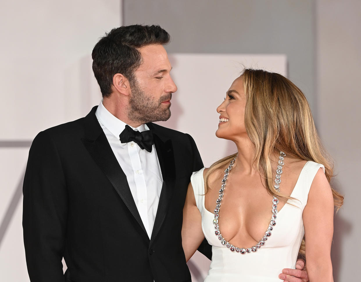 Ben Affleck looks lovingly at Jennifer Lopez during their red carpet debut (again) at the Venice Film Festival. (Photo: WireImage)