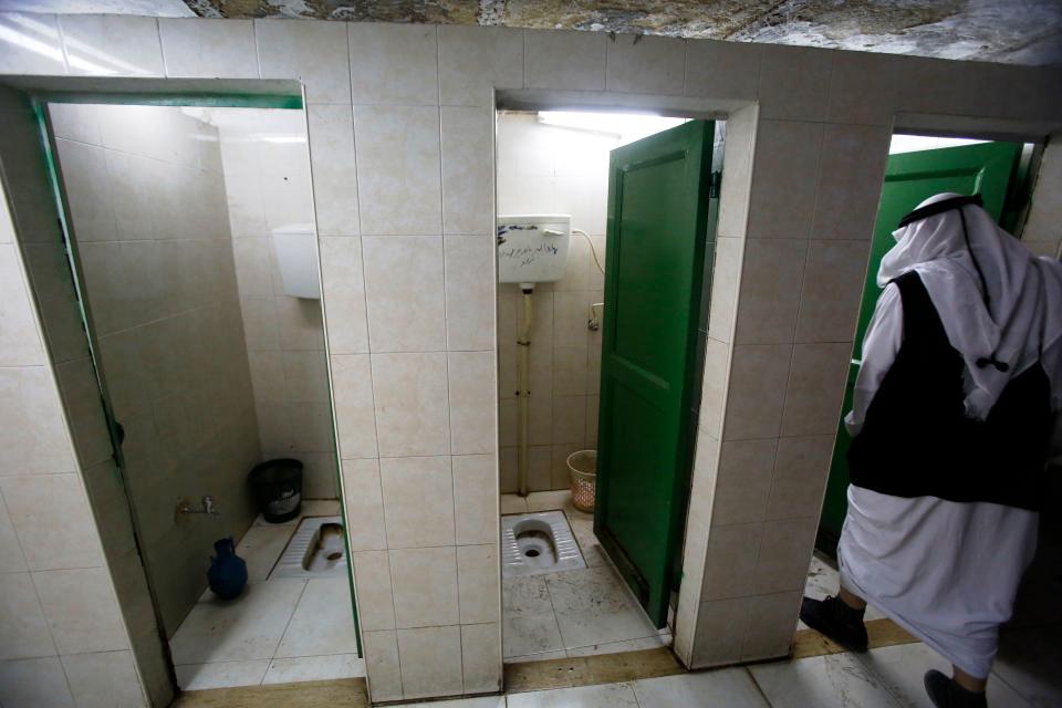 <p>Public toilets in the West Bank town of Hebron, Israel/Palestine. (Photo: Hazem Bader/AFP/Getty Images) </p>