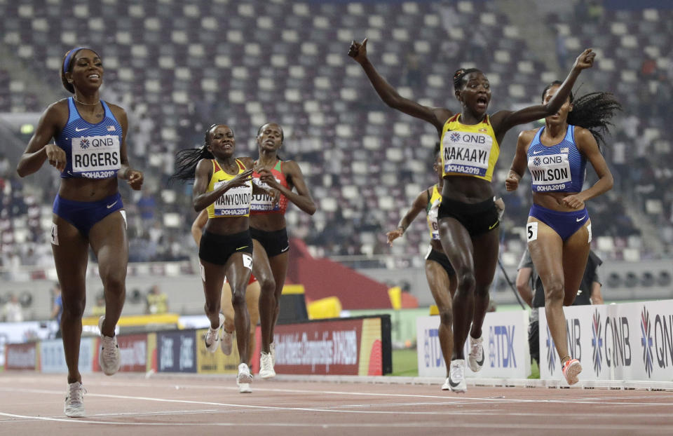 Halimah Nakaayi, of Uganda celebrates as she wins the gold medal in the women's 800m final ahead of Raevyn Rogers, of the United States, at the World Athletics Championships in Doha, Qatar, Monday, Sept. 30, 2019. (AP Photo/Petr David Josek)