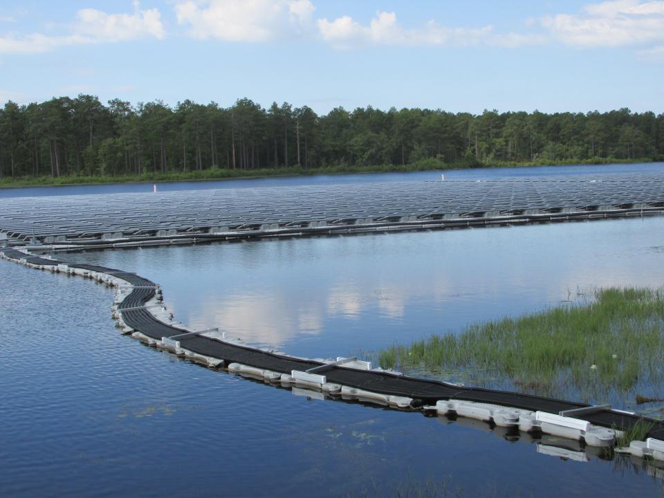 Solar panels on nearly 2.5 surface acres of Big Muddy Lake at Camp Mackall are part of a clean energy project collaboration between Fort Bragg, Duke Energy and Ameresco and is the first project of its kind for the Department of Defense.