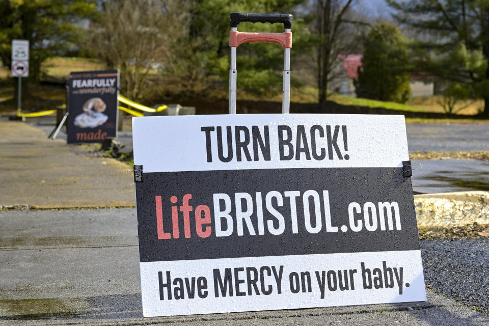 Anti-abortion signs are displayed outside Bristol Women's Health Clinic on Thursday, Feb. 23, 2023 in Bristol, Va. Residents in southwestern Virginia have battled for months over whether abortion clinics limited by strict laws in other states should be allowed to hop over the border and operate there. Similar scenarios are beginning to play out in communities along state lines around the country since the U.S. Supreme Court overturned Roe v. Wade. (AP Photo/Earl Neikirk)