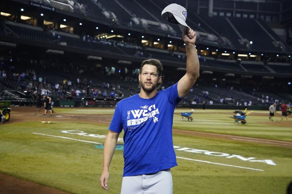 Dodgers pitcher Clayton Kershaw waves to Dodgers fans after the team's 4-0 win over the Arizona Diamondbacks