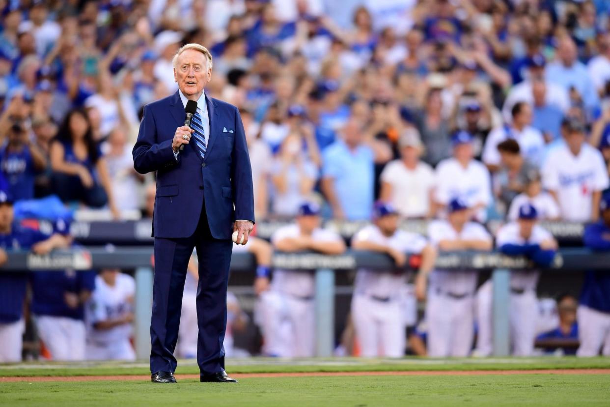Hall of Fame broadcaster Vin Scully walks onto the field before Game 2 of the 2017 World Series between the Houston Astros and the Los Angeles Dodgers at Dodger Stadium.