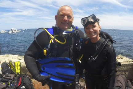 In this 2018 photo, provided by Christine Dignam is her husband Justin Dignam, left, and their daughter Taylor at Santa Catalina Island, Calif. Justin Dignam was among 34 people who perished when fire swept through the Conception dive boat off the coast of Southern California on Sept. 2, 2019. (Christine Dignam via AP)