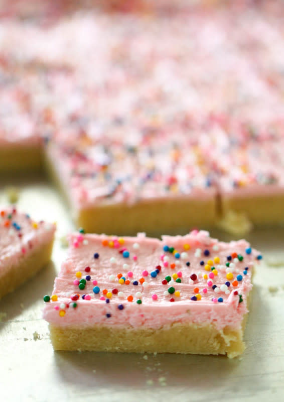 <p>Six Sisters' Stuff</p><p>These frosted sugar cookie bars are soft, chewy and topped with homemade buttercream frosting and sprinkles. These cookie bars are made in a sheet pan and can easily feed a crowd.</p><p><strong>Get the recipe: <a href="https://www.sixsistersstuff.com/recipe/sugar-cookie-bars-and-moms-frosting/" rel="nofollow noopener" target="_blank" data-ylk="slk:Frosted Sugar Cookie Bars;elm:context_link;itc:0;sec:content-canvas" class="link rapid-noclick-resp"><em>Frosted Sugar Cookie Bars</em></a></strong></p>