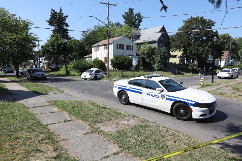 Rochester police collect evidence in the area of Bauman and Laser Streets in Rochester, NY on Friday, July 22, 2022. This was the area where two officers were shot, one fatally last night.