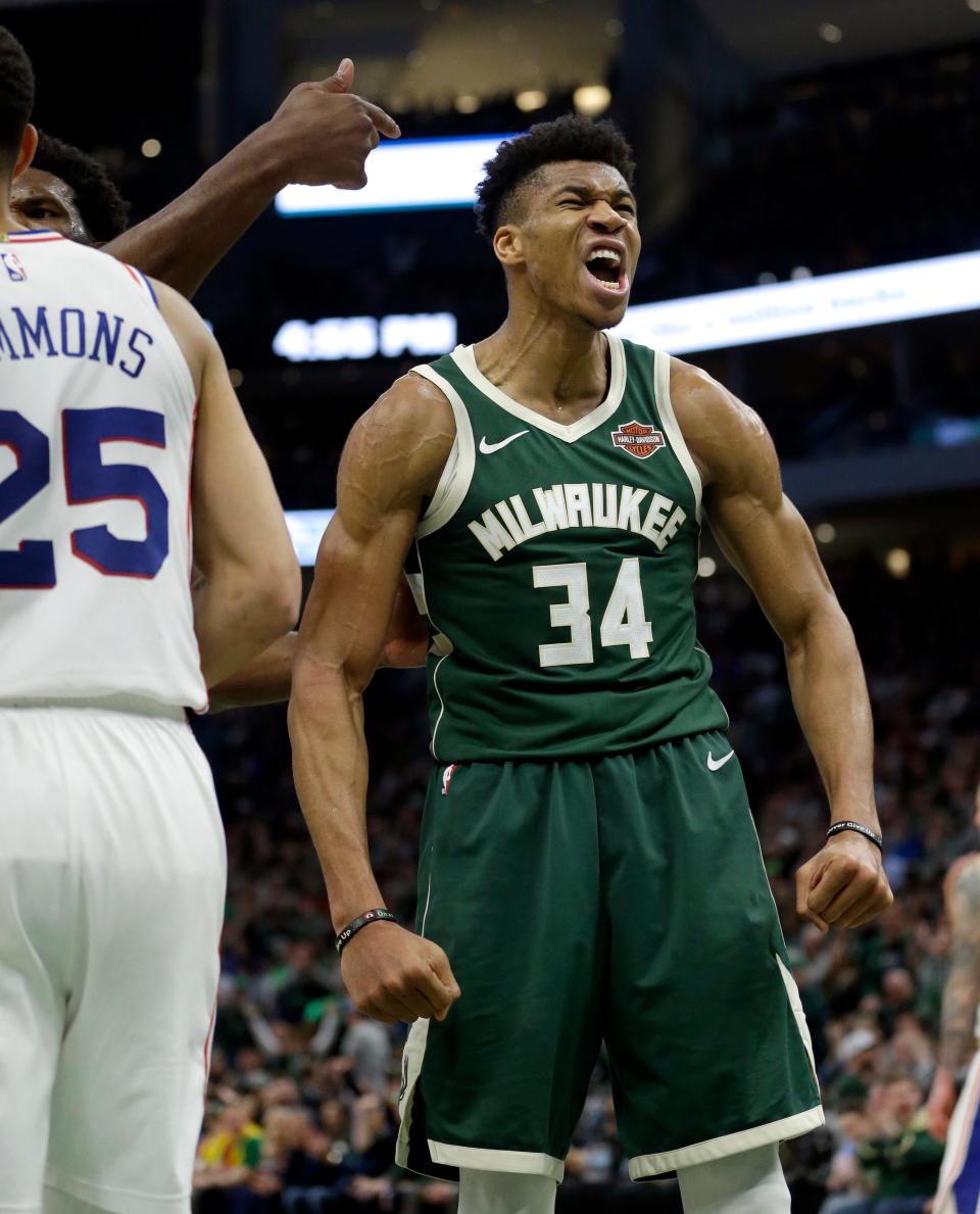 Milwaukee Bucks' Giannis Antetokounmpo reacts after making a shot during the second half of a game against the Philadelphia 76ers, March 17, 2019. He scored 52.