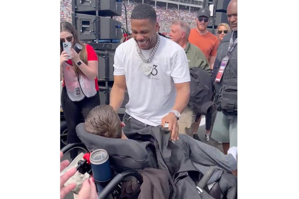 Watch Nelly Give His Jacket to Disabled Fan at Bank of America Roval 400 NASCAR Race in Sweet Video