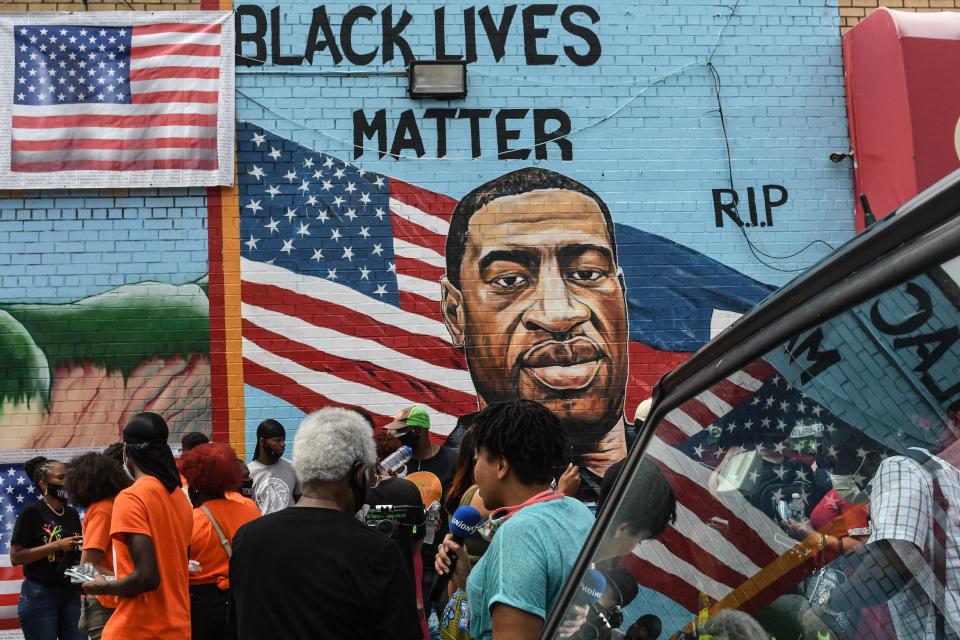 A mural painted by artist Kenny Altidor depicting George Floyd is unveiled on a sidewall of CTown Supermarket on July 13, 2020 in the Brooklyn borough New York City.