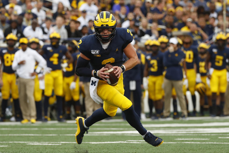 Michigan quarterback Shea Patterson runs for a two-yard touchdown against Rutgers in the first half of an NCAA college football game in Ann Arbor, Mich., Saturday, Sept. 28, 2019. (AP Photo/Paul Sancya)