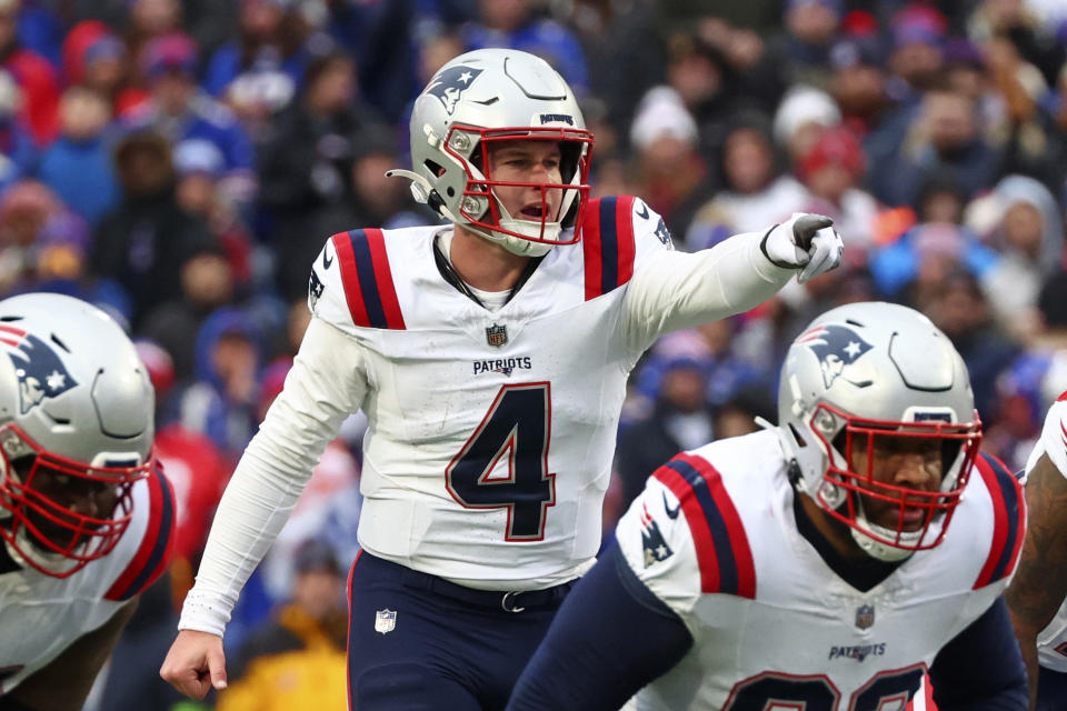 New England Patriots quarterback Bailey Zappe (4) calls signals during the second half of an NFL football game against the Buffalo Bills in Orchard Park, N.Y., Sunday, Dec. 31, 2023. (AP Photo/Jeffrey T. Barnes )