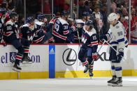 Washington Capitals left wing Sonny Milano (15) celebrates his goal with teammates in the second period of an NHL hockey game against the Tampa Bay Lightning, Friday, Nov. 11, 2022, in Washington. (AP Photo/Patrick Semansky)