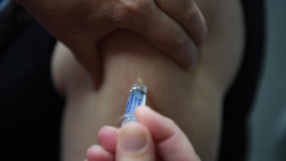 Australian residents urged to get flu vaccinations after peak summer season.