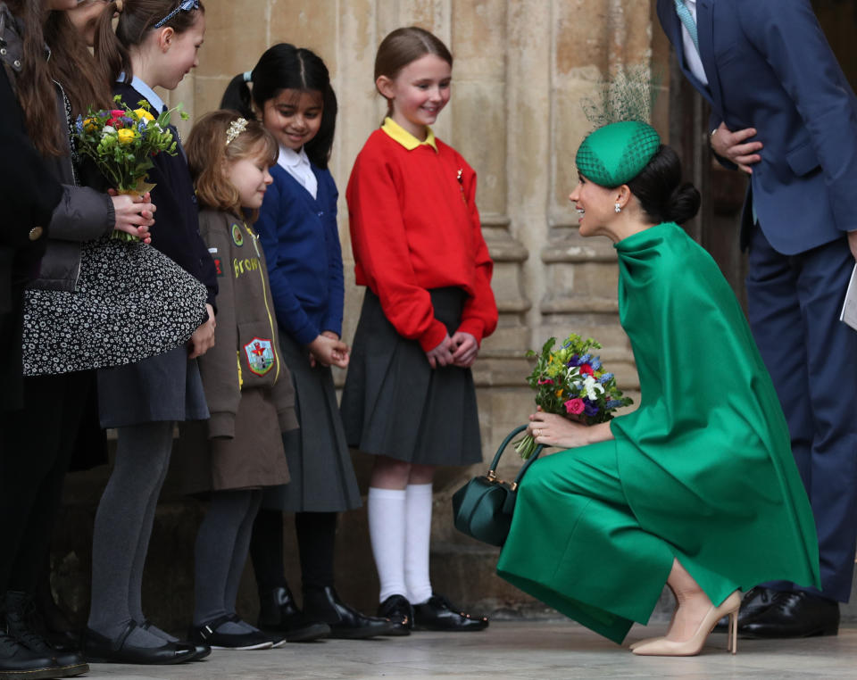 The Duchess of Sussex speaks to school children as she leaves Westminster Abbey, London, following the Commonwealth Service on Commonwealth Day.