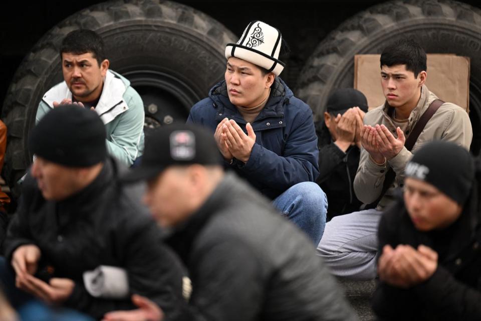 Muslims offer morning prayers to start the Eid al-Fitr festival, which marks the end of the holy fasting month of Ramadan, outside the Central Mosque in Moscow, Russia, on April 10, 2024. (Natalia Kolesnikova /AFP via Getty Images)