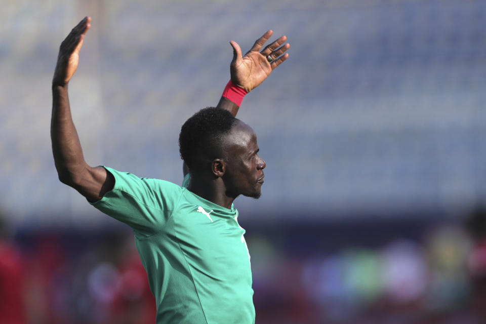 Senegal's Sadio Mane applauds fans prior to the start of the African Cup of Nations semifinal soccer match between Senegal and Tunisia in 30 June stadium in Cairo, Egypt, Sunday, July 14, 2019. (AP Photo/Hassan Ammar)