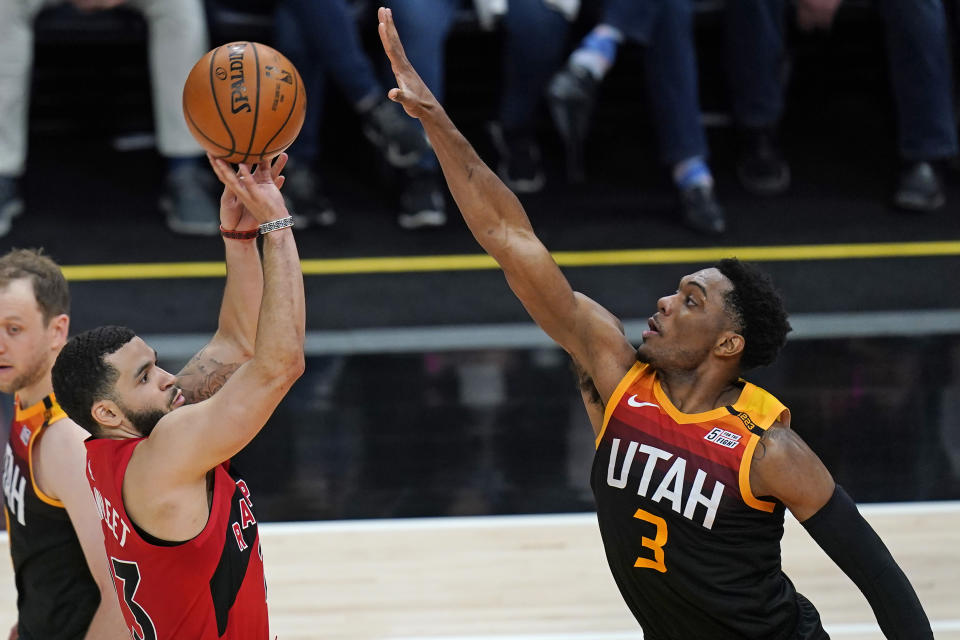 Toronto Raptors guard Fred VanVleet (23) shoots as Utah Jazz guard Trent Forrest (3) defends during the second half of an NBA basketball game Saturday, May 1, 2021, in Salt Lake City. (AP Photo/Rick Bowmer)