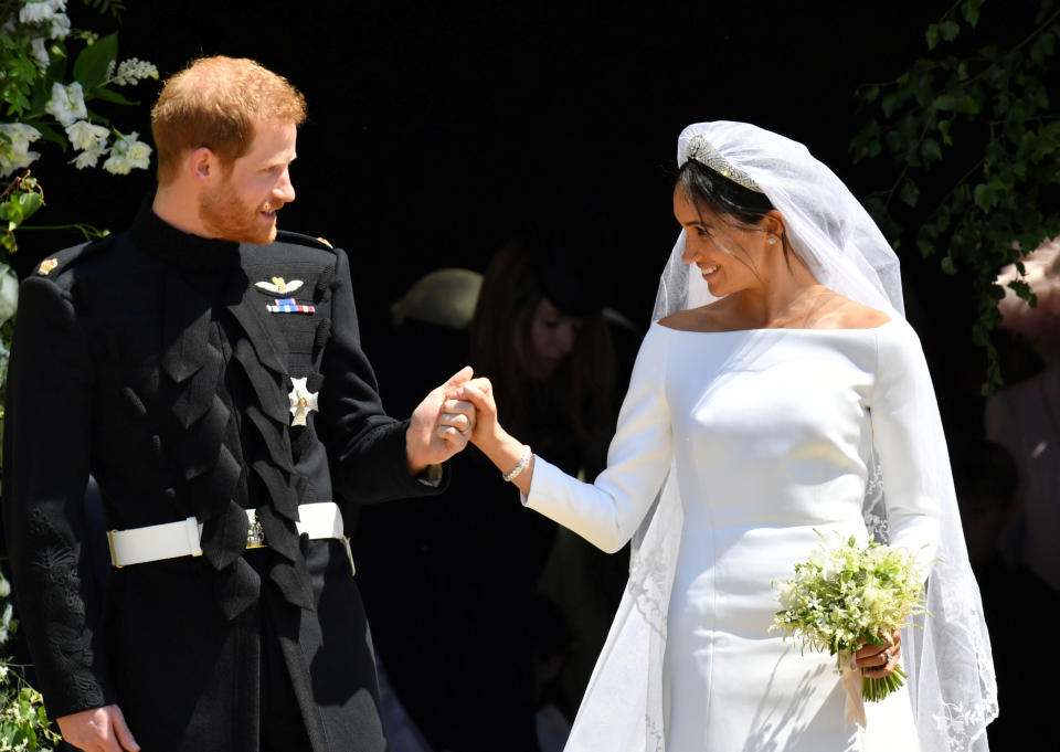 Prince Harry and Meghan Markle depart via the West Door of St George’s Chapel. Source: Reuters