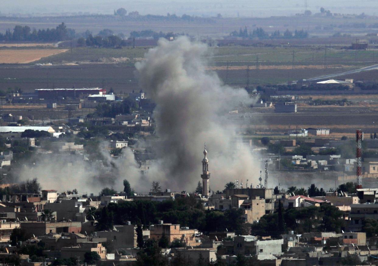 Smoke and dust billows from targets in Ras al-Ayn, Syria, caused by Turkish bombardment on Tuesday: AP