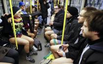 Passengers without their pants use a subway train during the "No Pants Subway Ride" in Berlin January 12, 2014. The event is an annual flash mob and occurs in different cities around the world, according to its organisers. REUTERS/Fabrizio Bensch (GERMANY - Tags: SOCIETY ENTERTAINMENT)