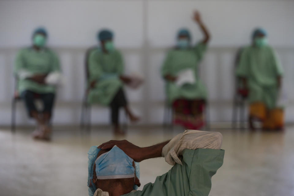 Patients receive anesthesia before cataract surgery at an eye camp in Lumbini, 288 kilometers (180 miles) south west of Kathmandu, Nepal, March 31, 2021. Nepal’s “God of Sight” eye doctor renowned for his innovative and inexpensive cataract surgery for the poor is taking his work beyond the Himalayan mountains to other parts of the world so there is no more unnecessary blindness in the world. Ruit, who has won many awards for his work and performed some 130,000 cataract surgery in the past three decades, is aiming to expand his work beyond the borders of his home country and the region to go globally. (AP Photo/Bikram Rai)