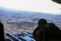 In this photo provided by the Greek Defense Ministry, military planes take part in a Greek-US military exercise over Athens, on Friday, Sept. 11, 2020. Prime Minister Kyriakos Mitsotakis was to outline the details of a program Saturday to boost Greece's defense capabilities, amid heightened tensions with neighboring Turkey over rights to resources in the eastern Mediterranean. (Greek Defense Ministry via AP)