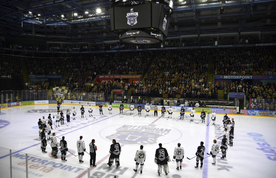 Players pay tribute before the Ice Hockey Adam Johnson memorial game between Nottingham Panthers and Manchester Storm at the Motorpoint Arena, Nottingham, England, Saturday, Nov. 18, 2023. The memorial game is held three weeks after Adam Johnson, 29, suffered a fatal cut to his neck during a game against Sheffield Steelers on Saturday, October 28, 2023. (AP Photo/Rui Vieira)